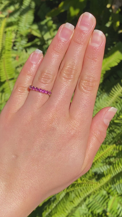 18K gold pink tourmaline half eternity ring.