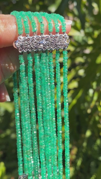 14K gold diamond and 7 strand emerald necklace.