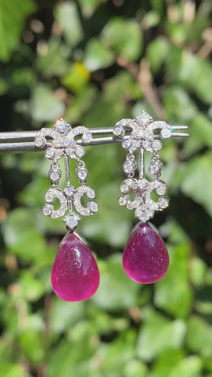 18K gold glass-filled ruby and diamond drop earrings.
