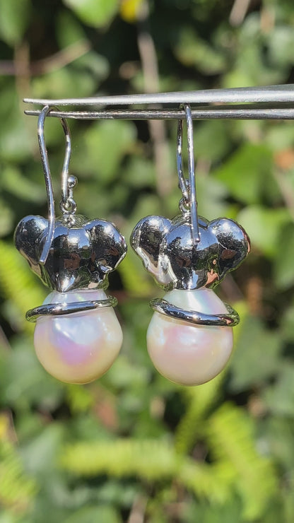 14K gold baroque pearl and diamond elephant earrings.