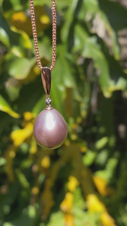 9K gold freshwater pearl and diamond pendant with 18K gold chain.