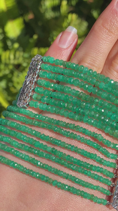 14K gold diamond and 7 strand emerald necklace.