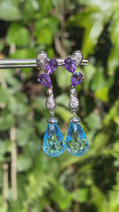 18K gold blue topaz, amethyst, and diamond earrings.