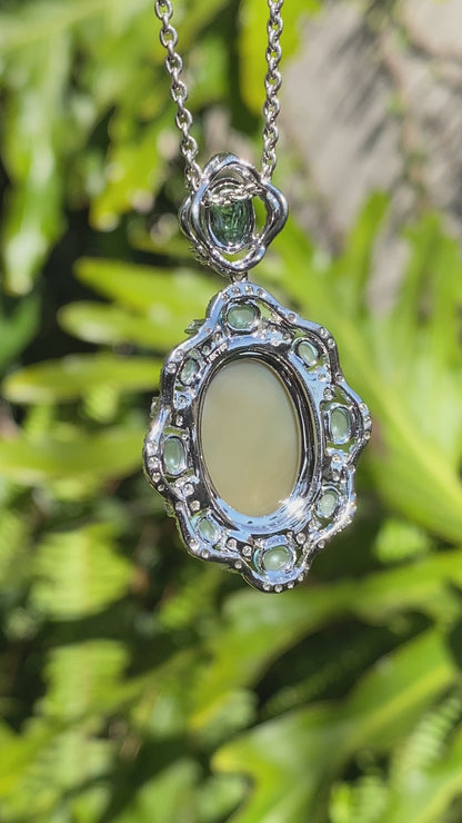 18K gold agate cameo, blue topaz and diamond pendant.