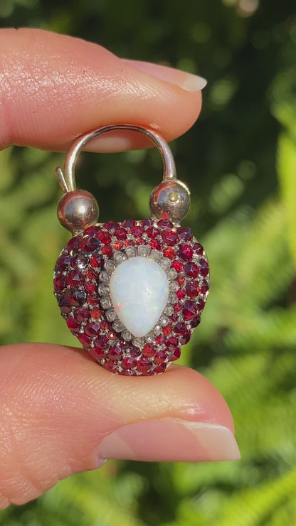 9K gold Victorian opal, garnet, seed pearl, and diamond locket and padlock clasp, circa 1850's.