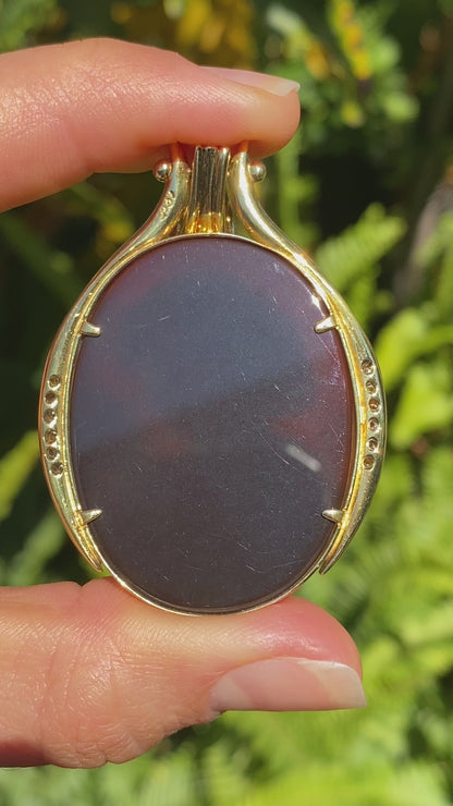 18K gold hard stone cameo and diamond pendant.