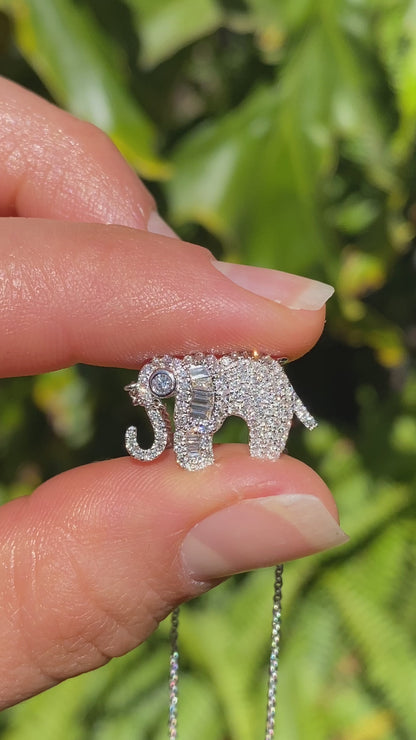 18K gold diamond elephant necklace.