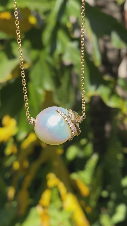 14K gold baroque pearl and diamond floating necklace.