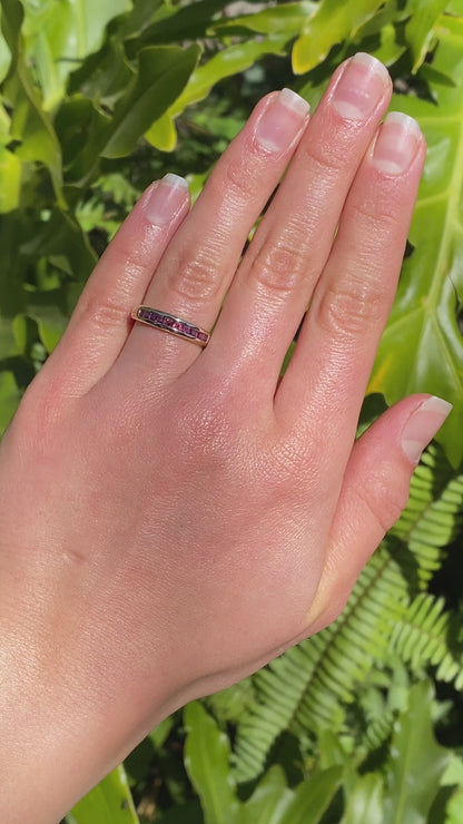9K gold rhodolite garnet half eternity ring.