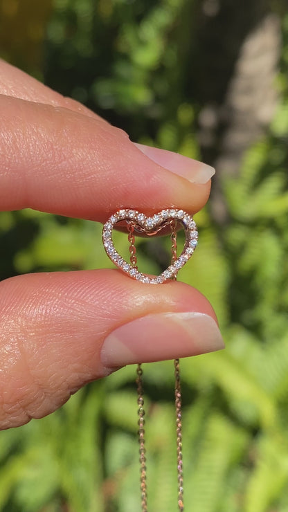 9K gold diamond heart pendant.