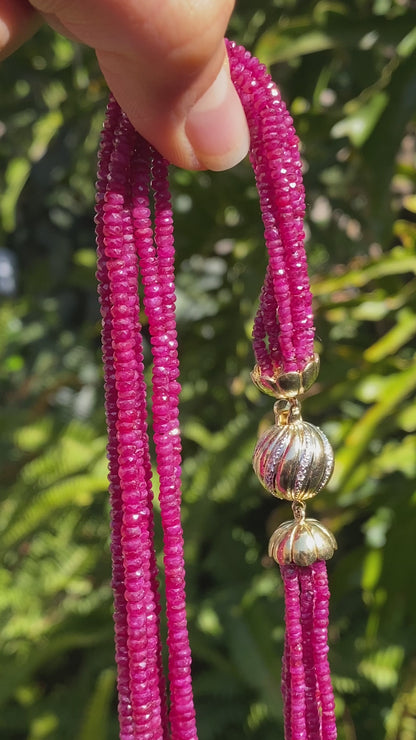 14K gold diamond and 7-strand ruby necklace.