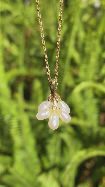 9K gold pearl 'tassel' and diamond pendant.