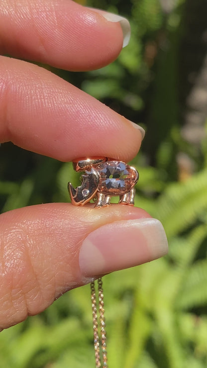 18K gold morganite and diamond rhino pendant.
