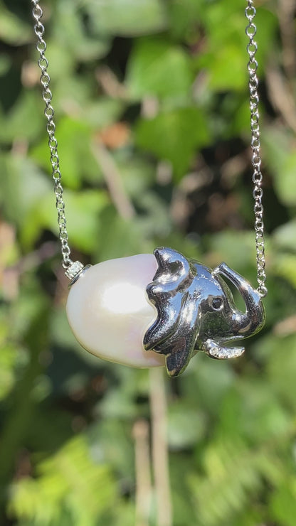 14K gold floating baroque pearl and diamond elephant necklace.