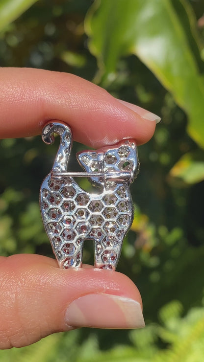 18K gold fancy sapphire, tsavorite garnet and diamond cat pendant/brooch.