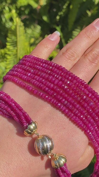 14K gold diamond and 7-strand ruby necklace.
