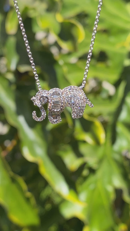 18K gold diamond elephant necklace.