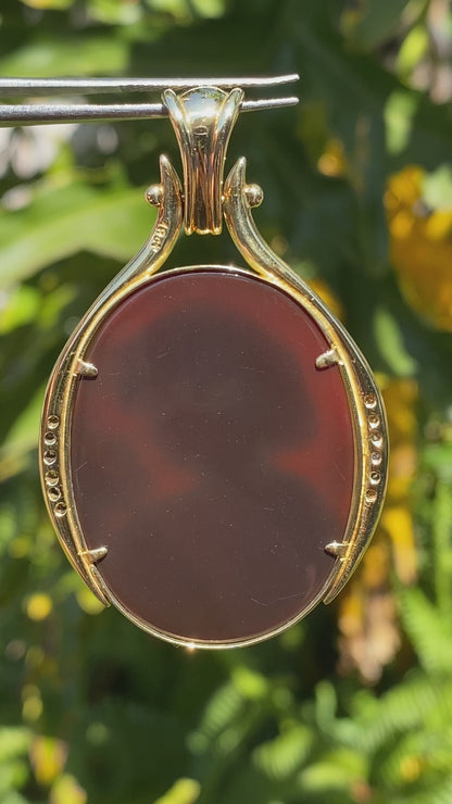 18K gold hard stone cameo and diamond pendant.