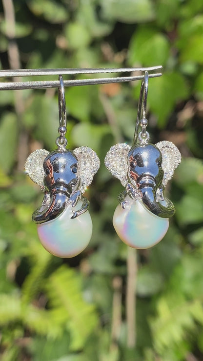 14K gold baroque pearl and diamond elephant earrings.