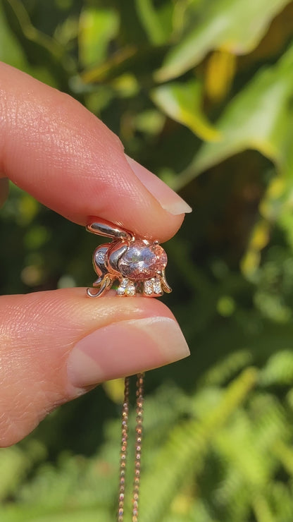 18K gold morganite and diamond elephant pendant.