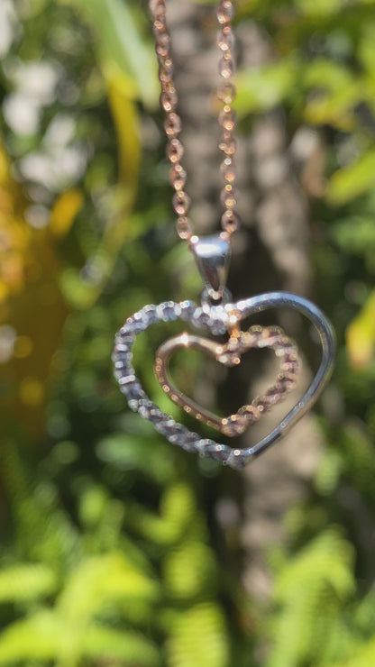 18K gold double-heart pendant.