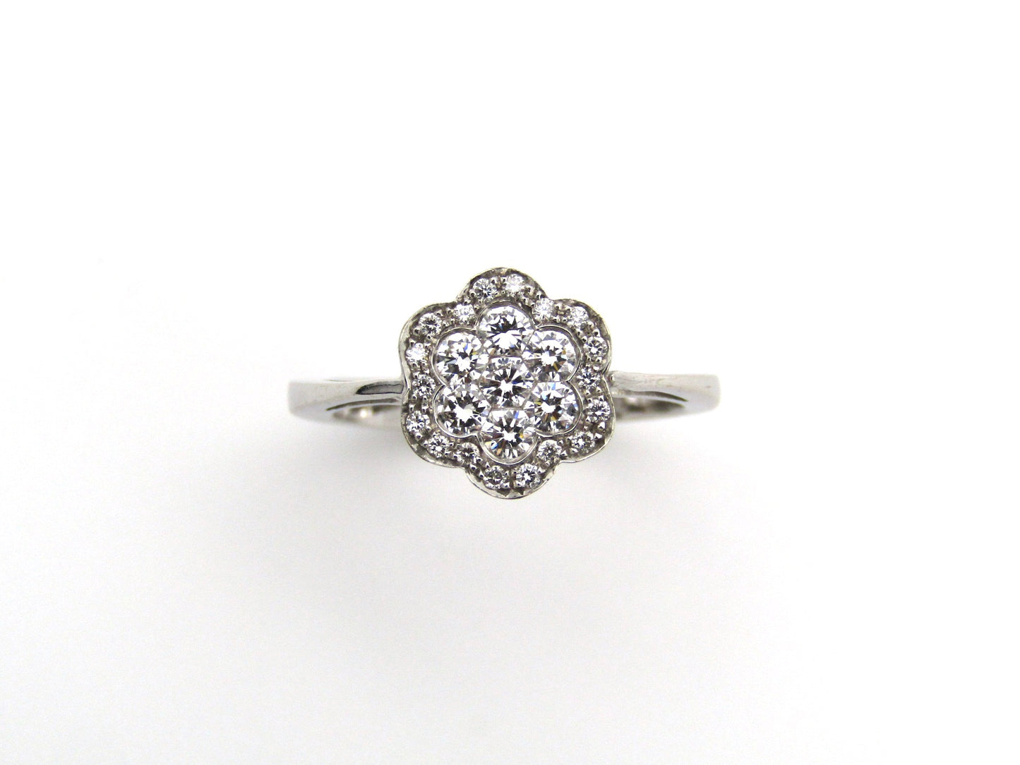 18K gold diamond flower ring.