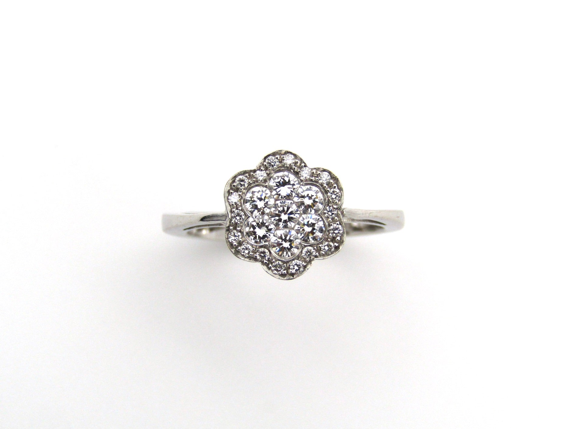 18K gold diamond flower ring.