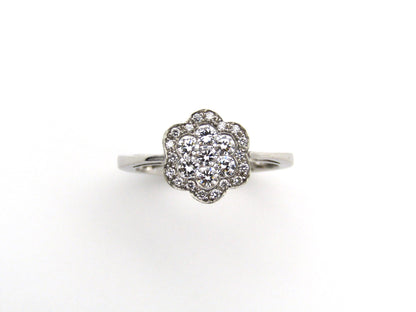 18K gold diamond flower ring.