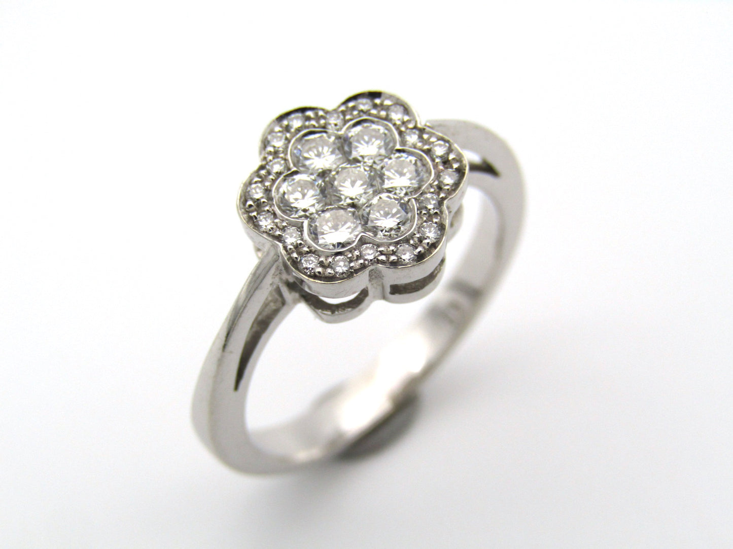 18K gold diamond flower ring.