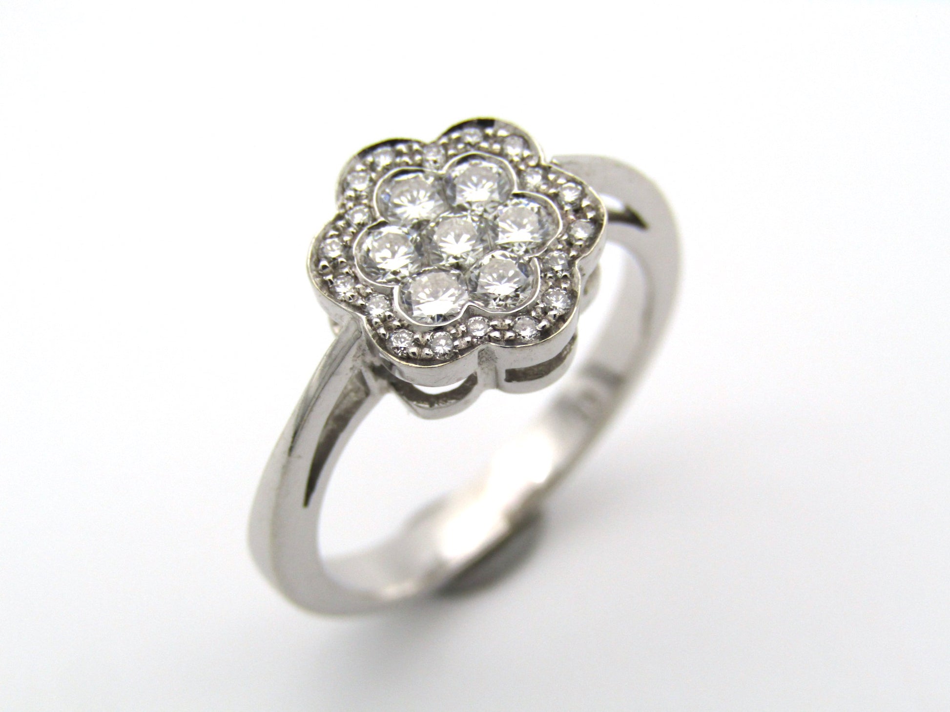 18K gold diamond flower ring.