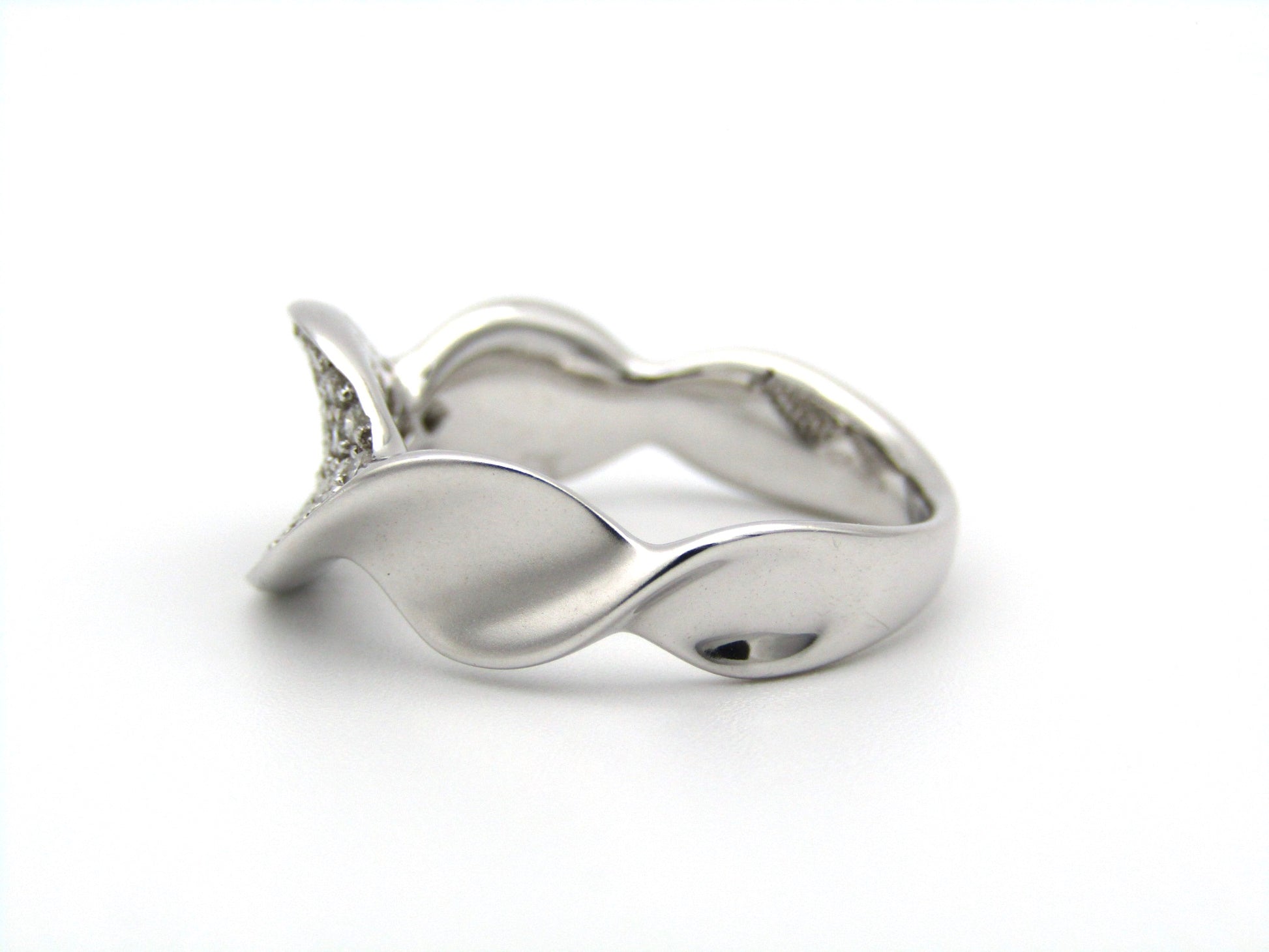 18K gold twist diamond ring.