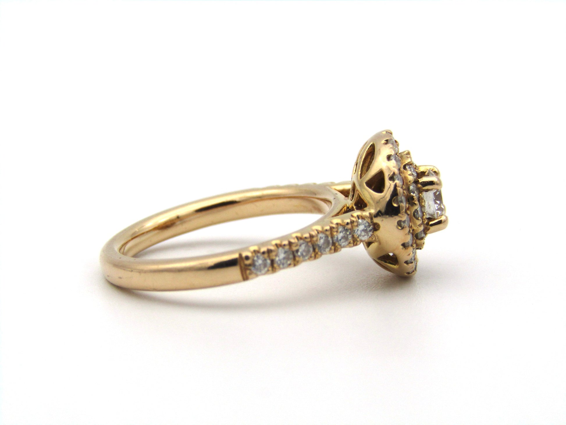 18K gold diamond halo ring.