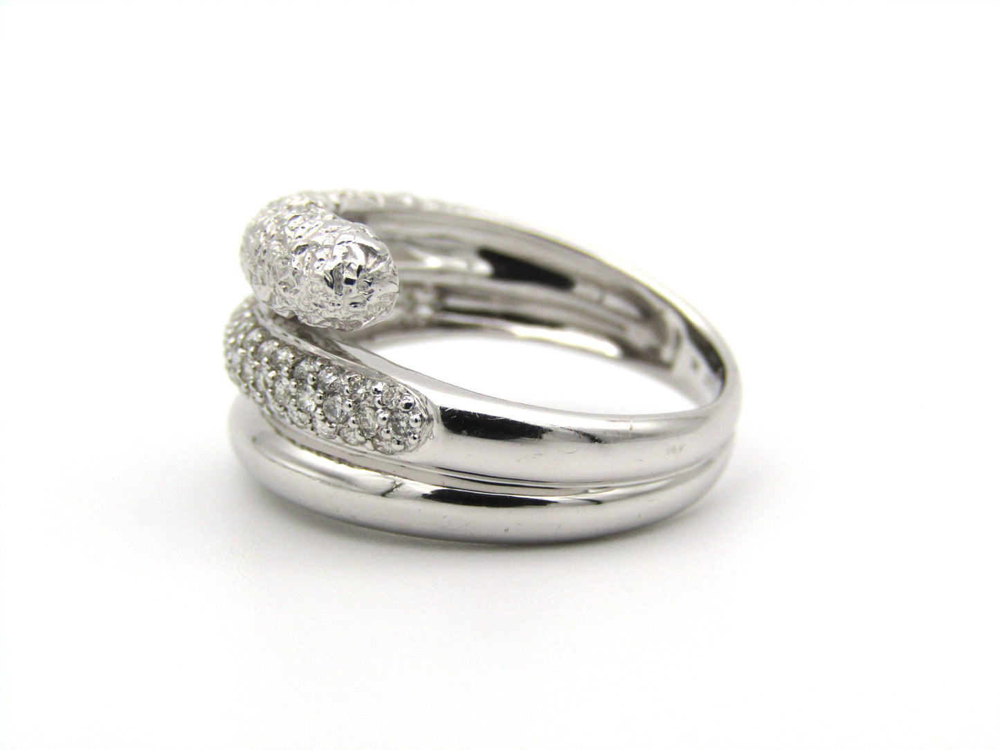 9K gold diamond twist ring.