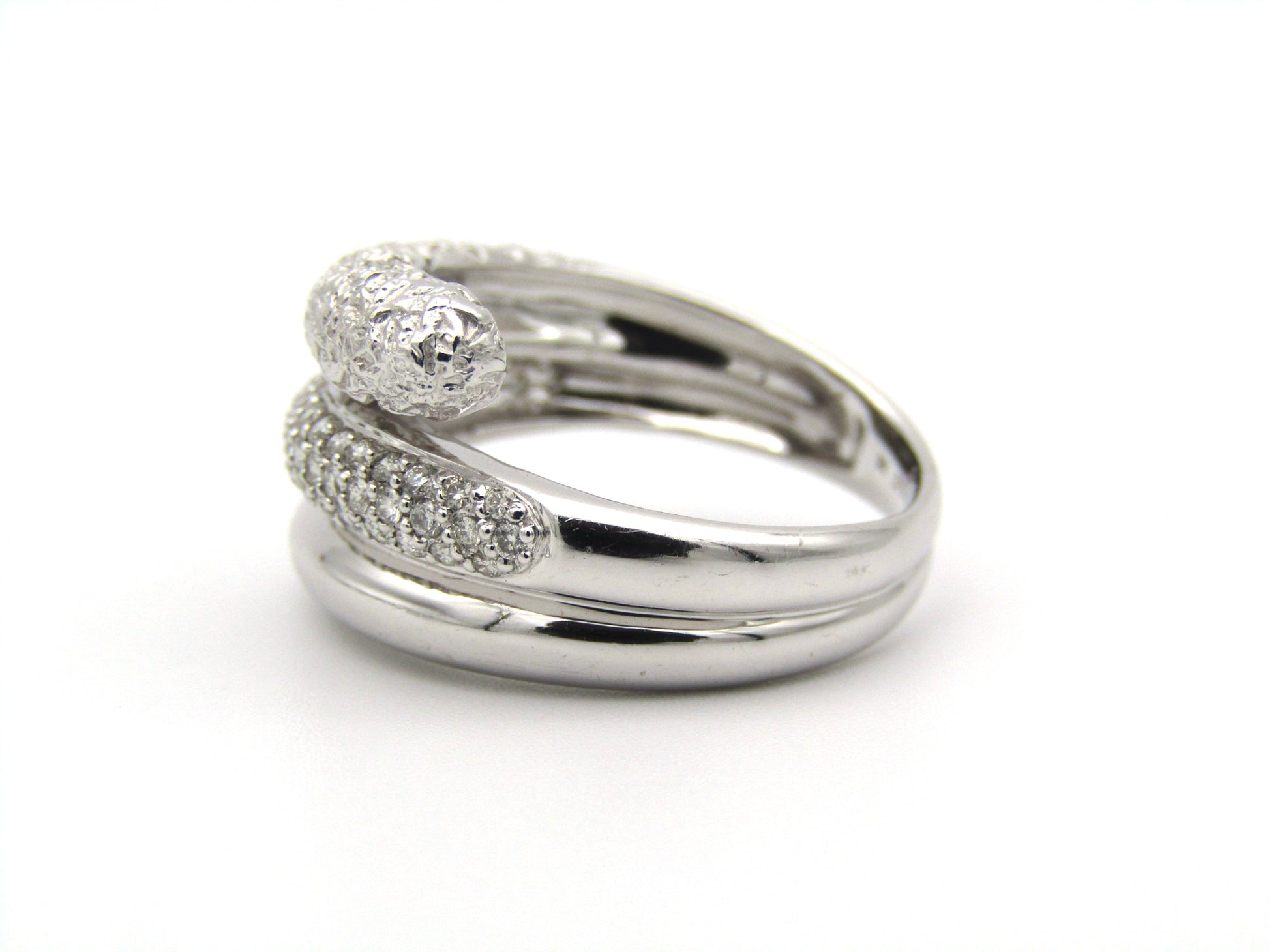 9K gold diamond twist ring.