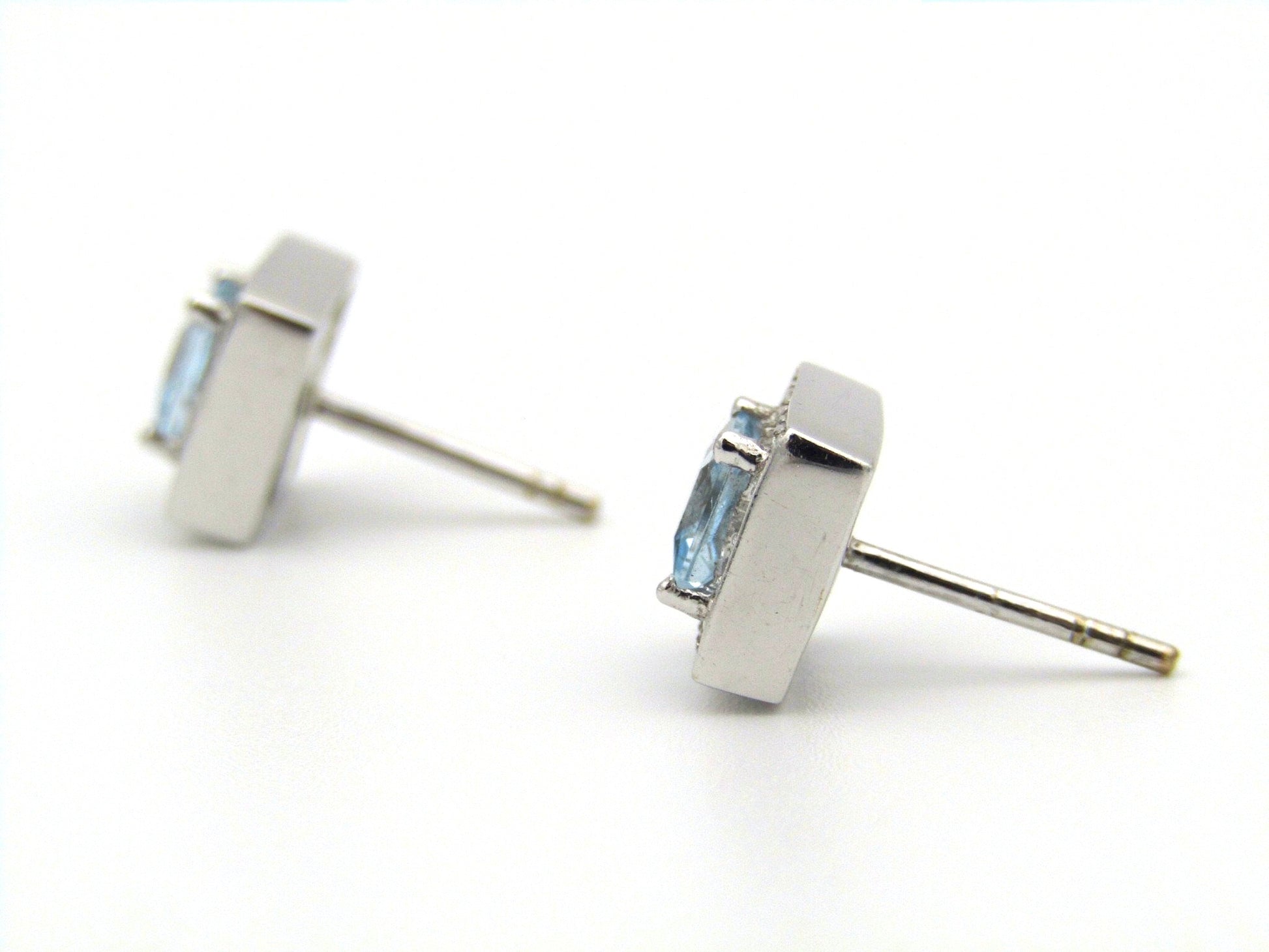 A pair of 18kt gold Blue Topaz and diamond earrings.