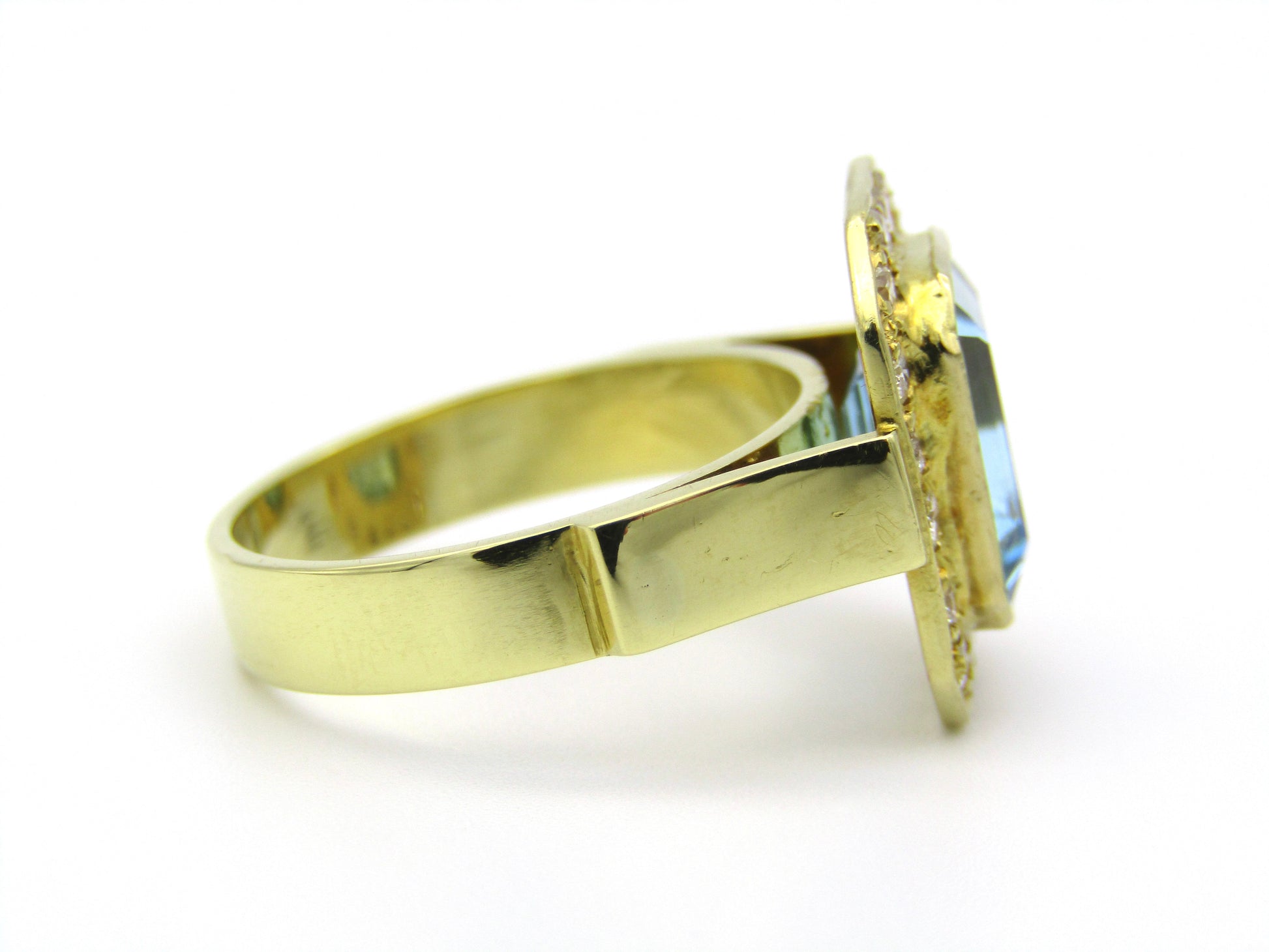 18kt yellow gold blue topaz and diamond ring.