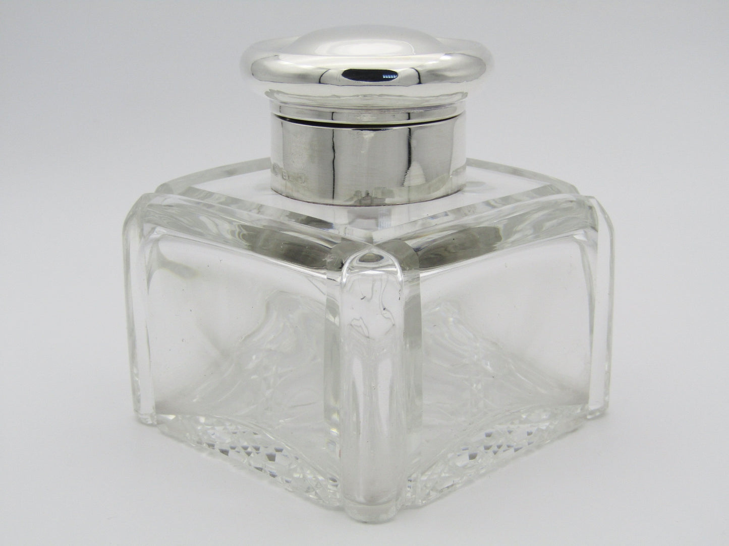 A silver mounted and cut glass desk inkwell by Asprey & Co. Ltd, Birmingham, 1915.