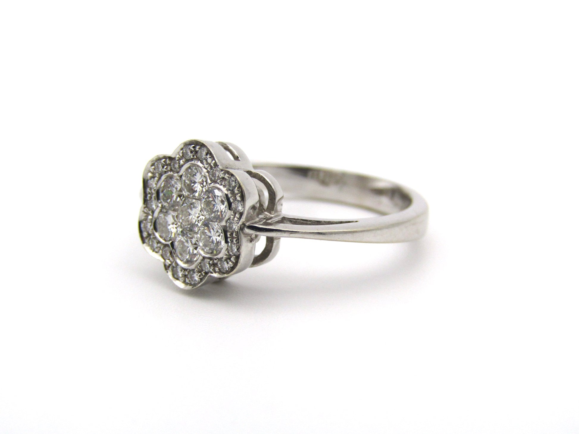 18K gold diamond flower ring.