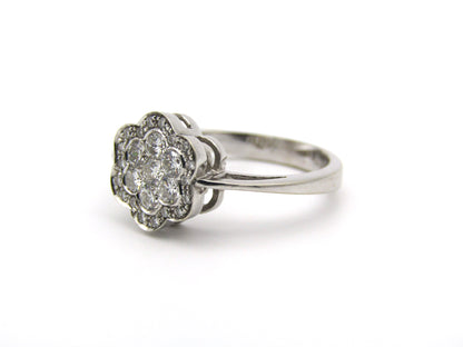 18K gold diamond flower ring.