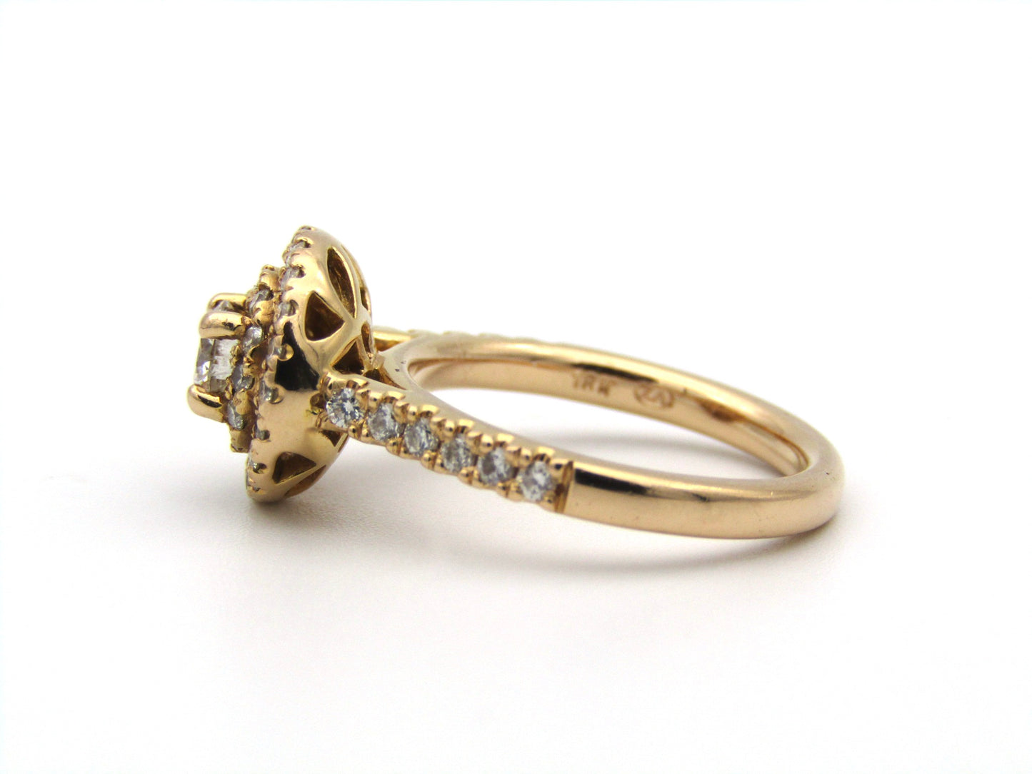 18K gold diamond halo ring.