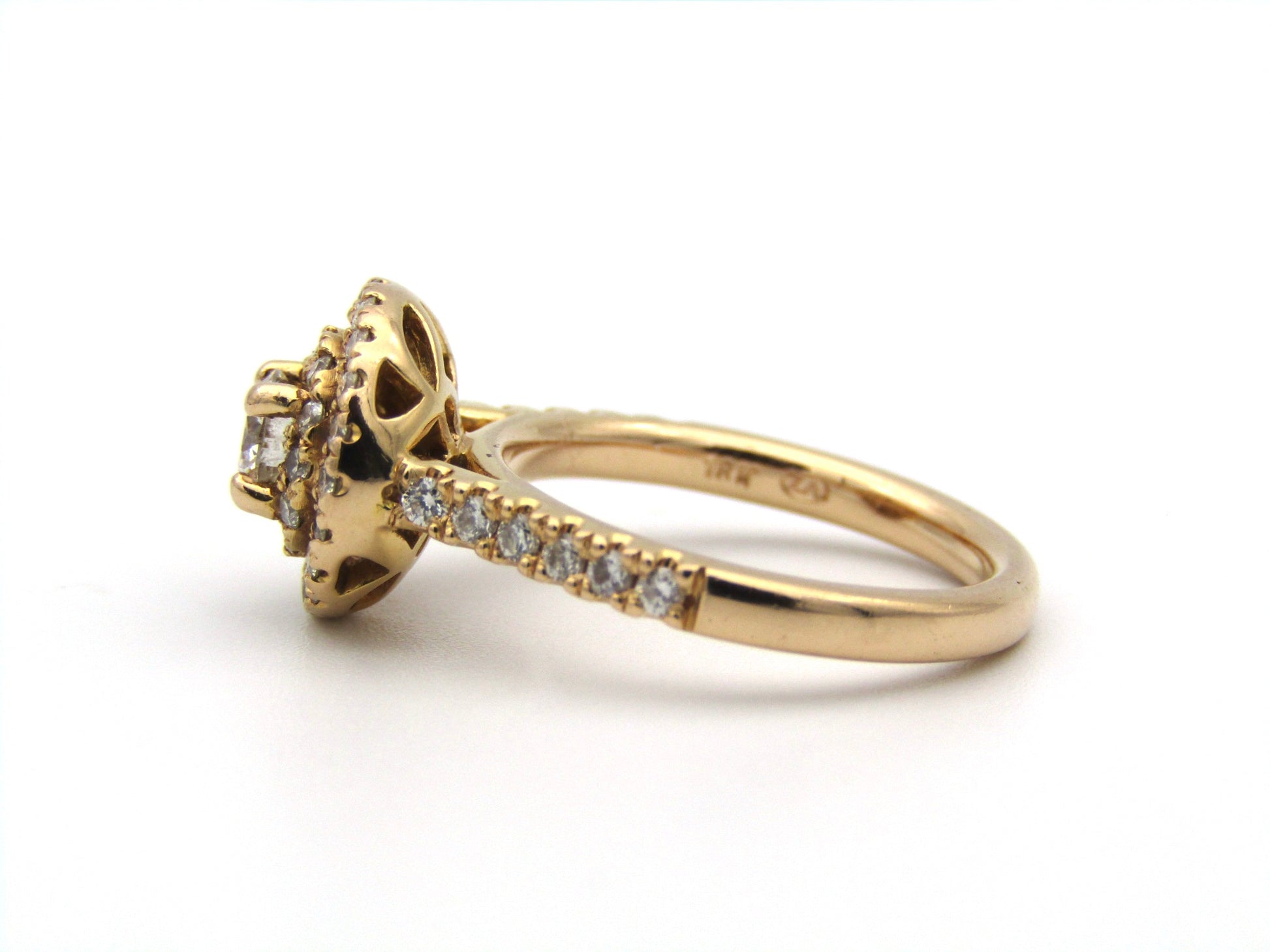 18K gold diamond halo ring.