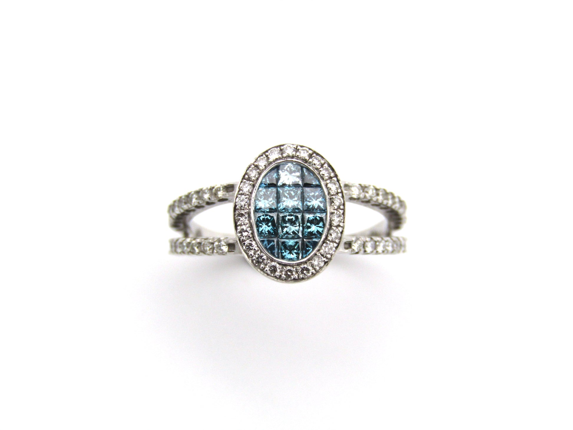 18K gold blue and colourless diamond ring.