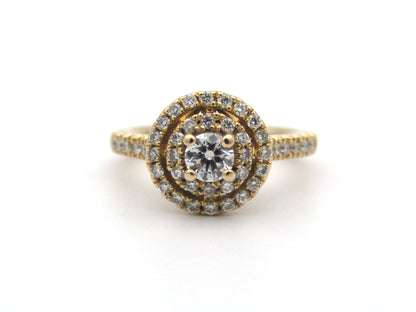 18K gold diamond halo ring.