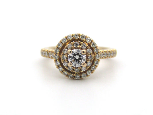 18K gold diamond halo ring.