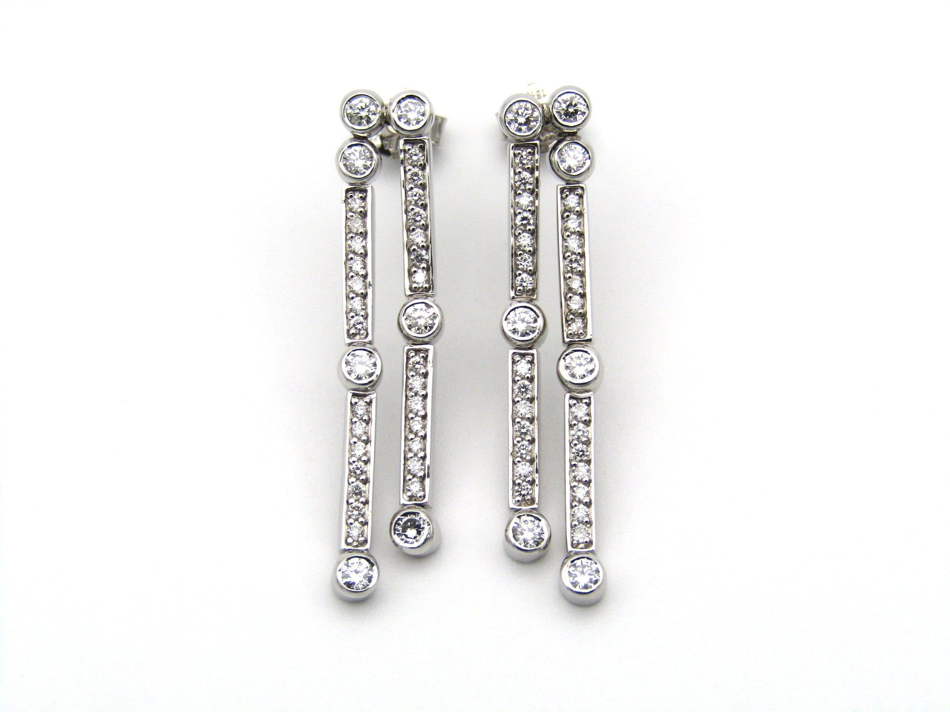 18K gold diamond drop earrings.