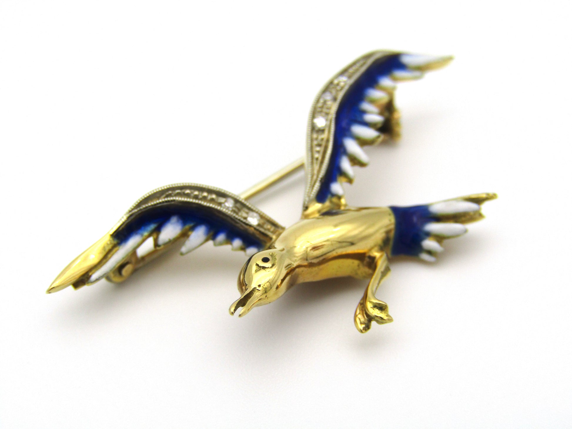 18kt gold diamond and enamel "Bird in flight" brooch.