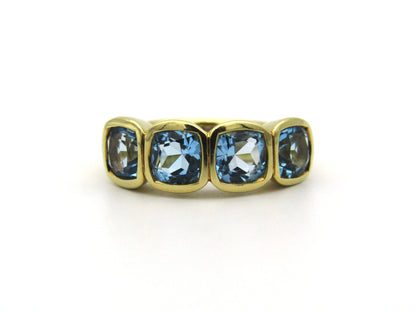18K gold blue topaz ring.