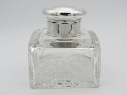 A silver mounted and cut glass desk inkwell by Asprey & Co. Ltd, Birmingham, 1915.
