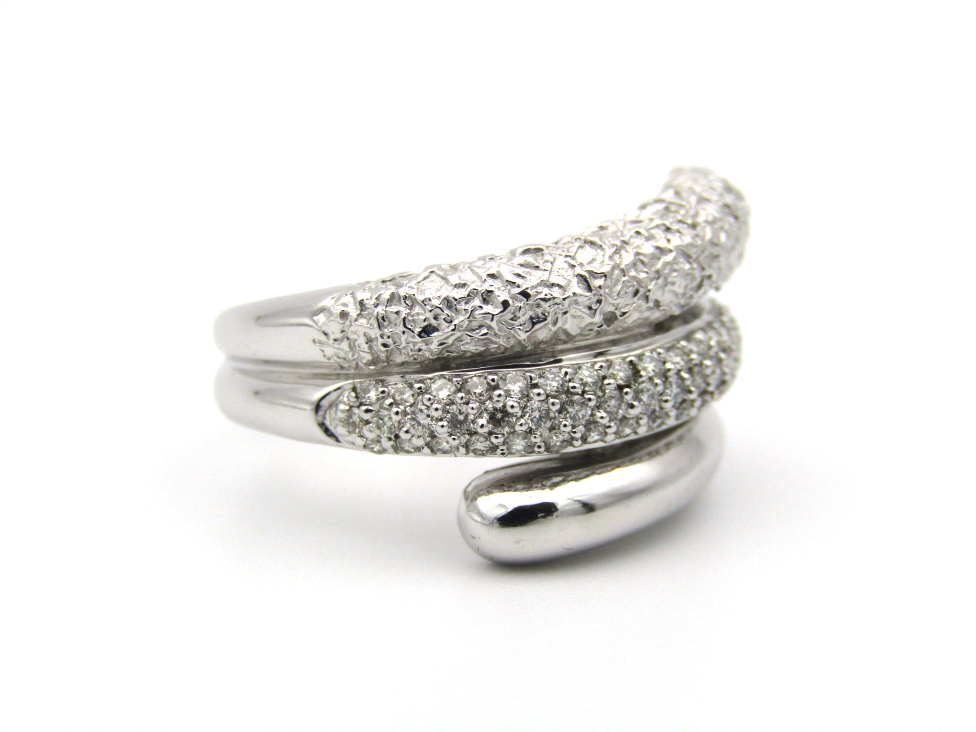 9K gold diamond twist ring.
