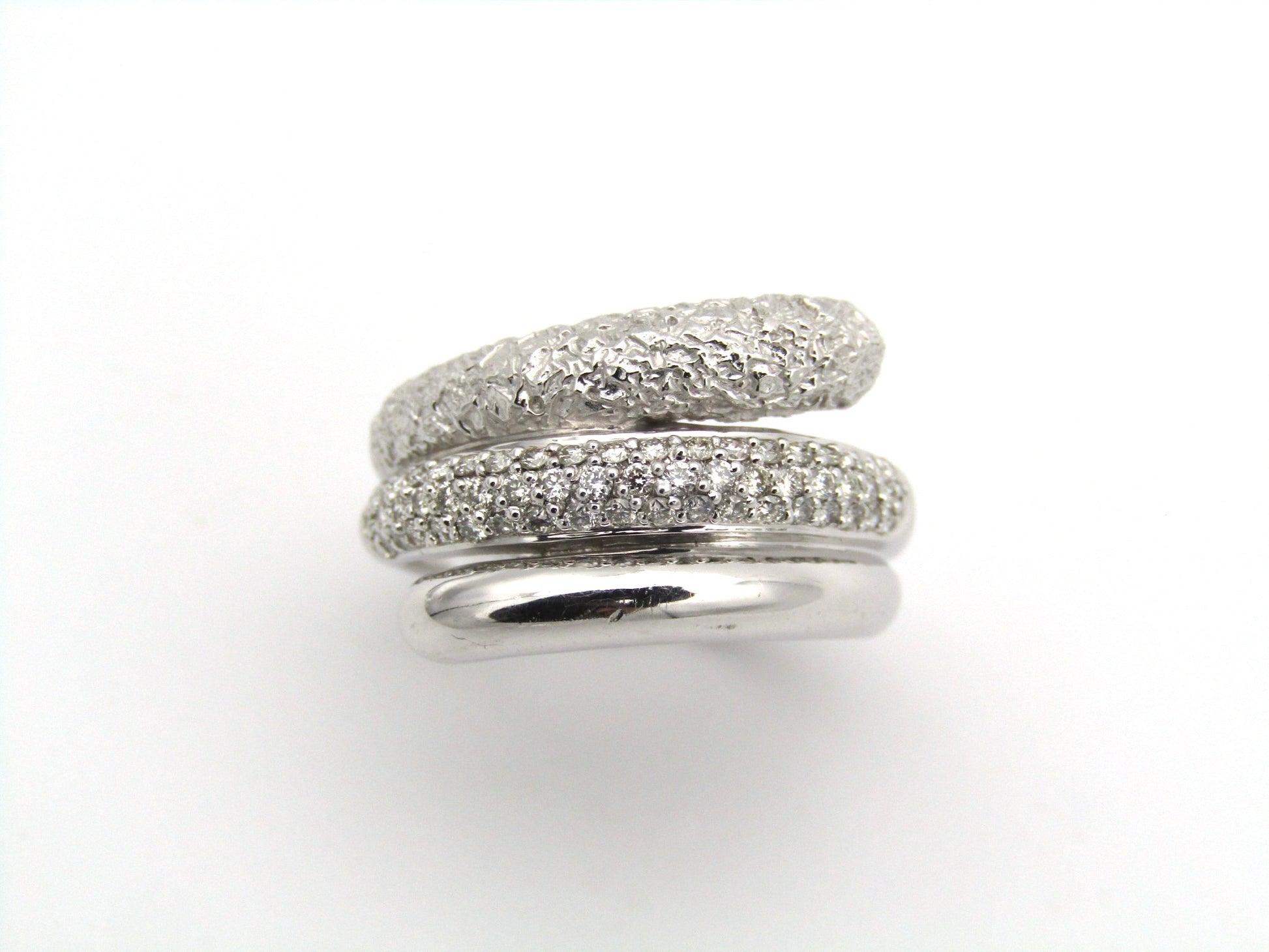 9K gold diamond twist ring.